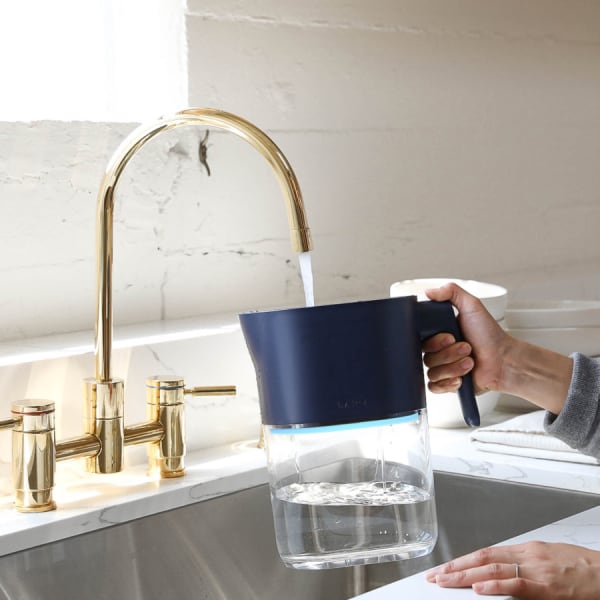 Photo of Larq Pitcher PureVis™ - Monaco Blue under a kitchen water tap