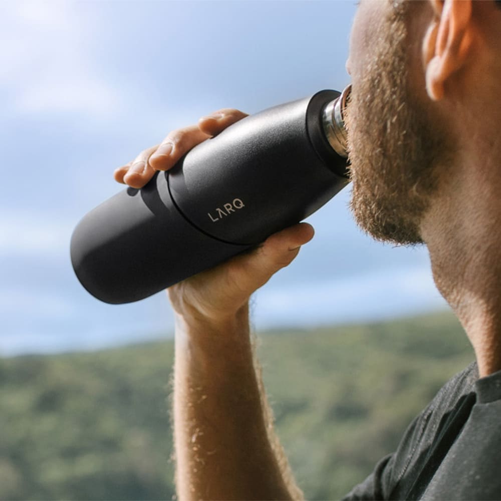 Larq PureVis™ bottle being in use