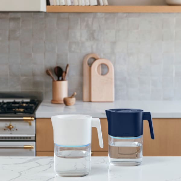 Photo of Larq Pitcher PureVis™ - Monaco Blue & Pure White on a kitchen counter